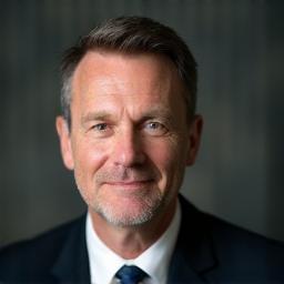 Professional headshot of Dr. Hans Fischer