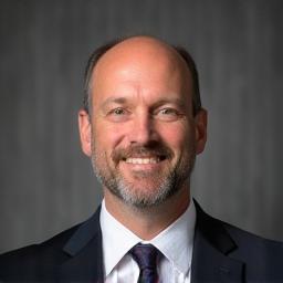 Professional headshot of Mark Jenkins